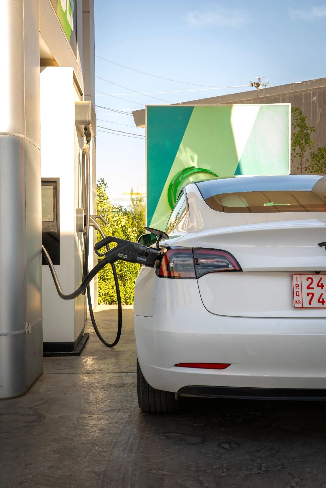 Commercial EV charging station powering an electric vehicle