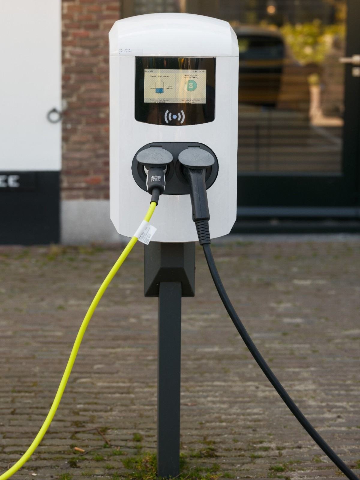 EV charging station with connected charging cables