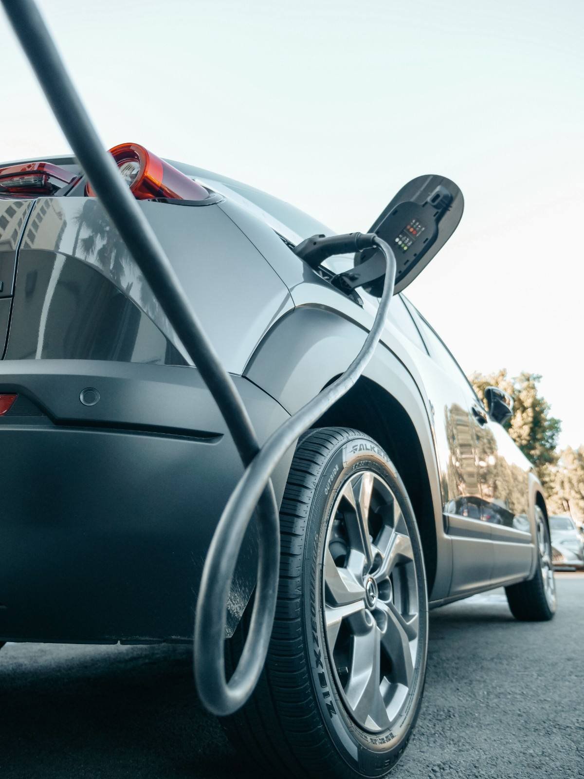 Level 2 EV charger connected to an electric vehicle at home