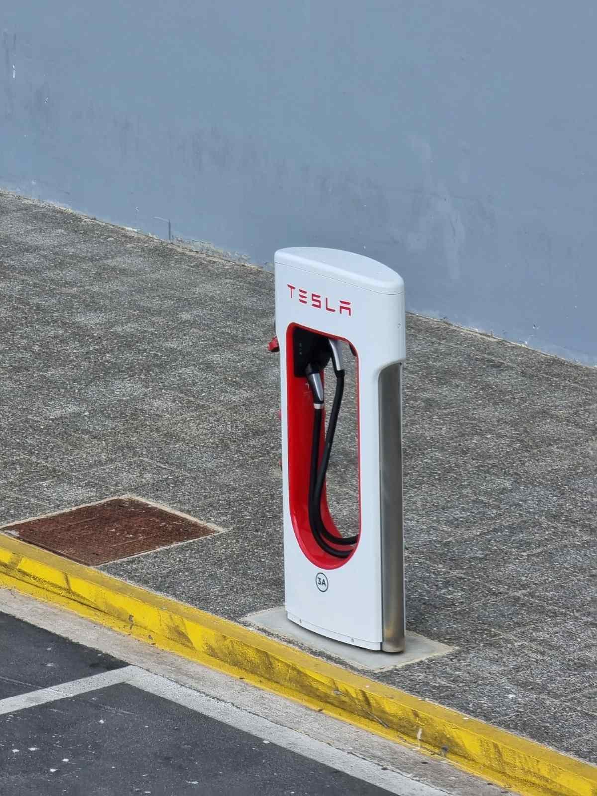 Tesla Supercharger station with charging cable