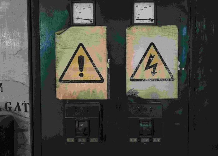 Electrical panels with high voltage warning signs in West Palm Beach, FL
